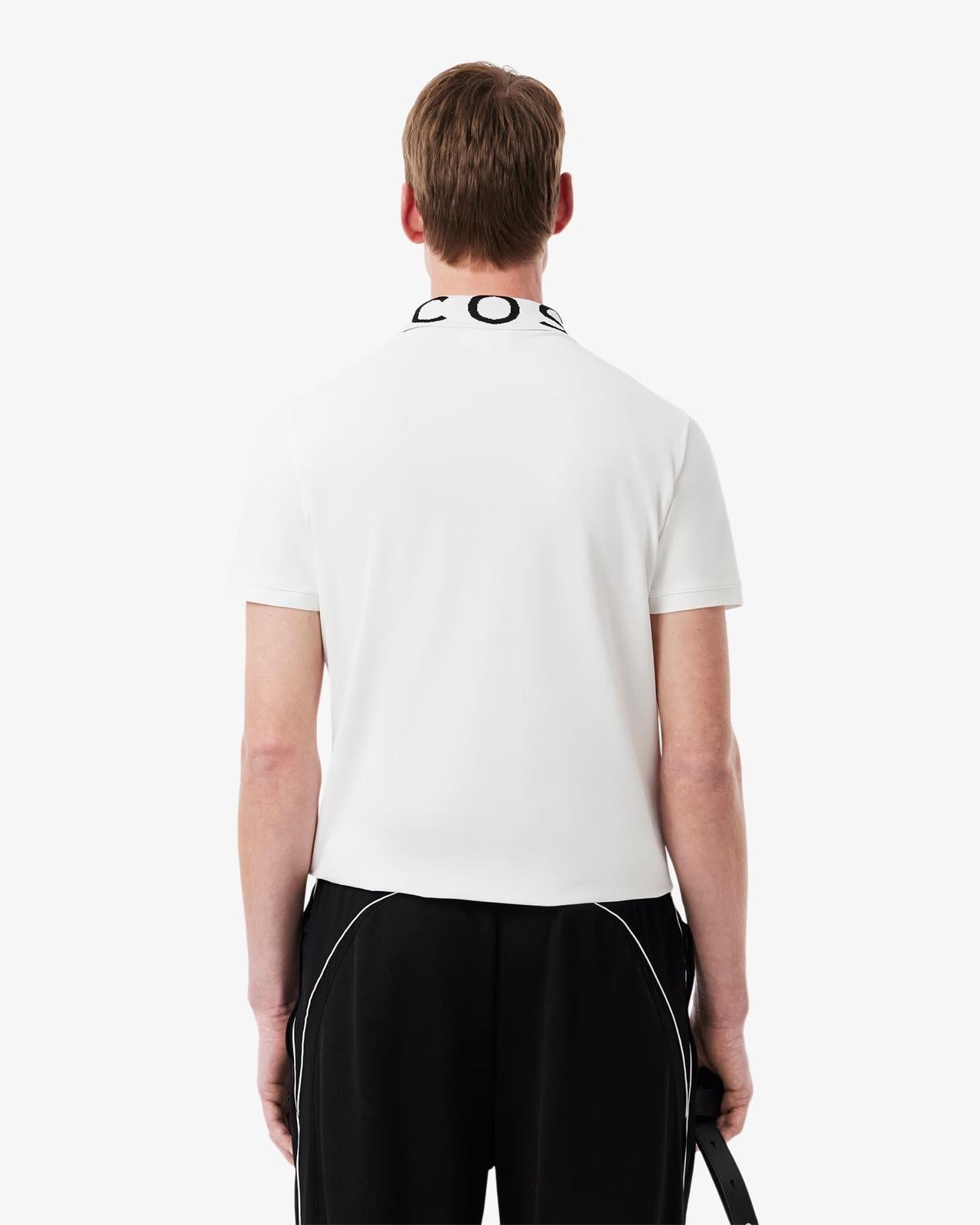 Polo Lacoste con logo sul colletto a contrasto jacquard
