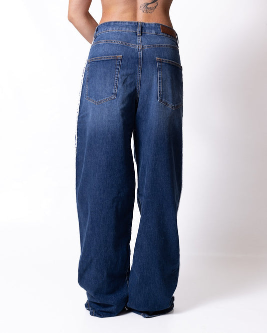 Jeans Palm Angels a palazzo con dettagli taglio vivo e logo patch