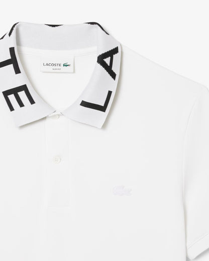 Polo Lacoste con logo sul colletto a contrasto jacquard