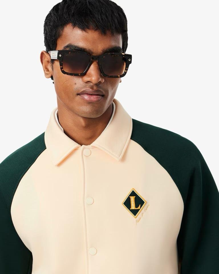 Felpa polo Lacoste con patch logo e color block