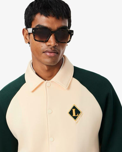 Felpa polo Lacoste con patch logo e color block