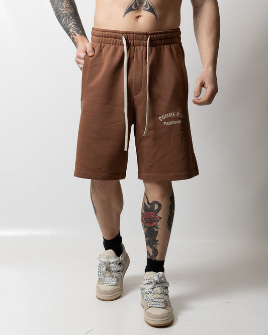 Bermuda Comme des Fuckdown in felpa con tagli e logo uomo