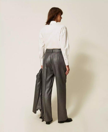 Pantalone Twinset Actitude gessato con finitura laminata e applicazioni decorative