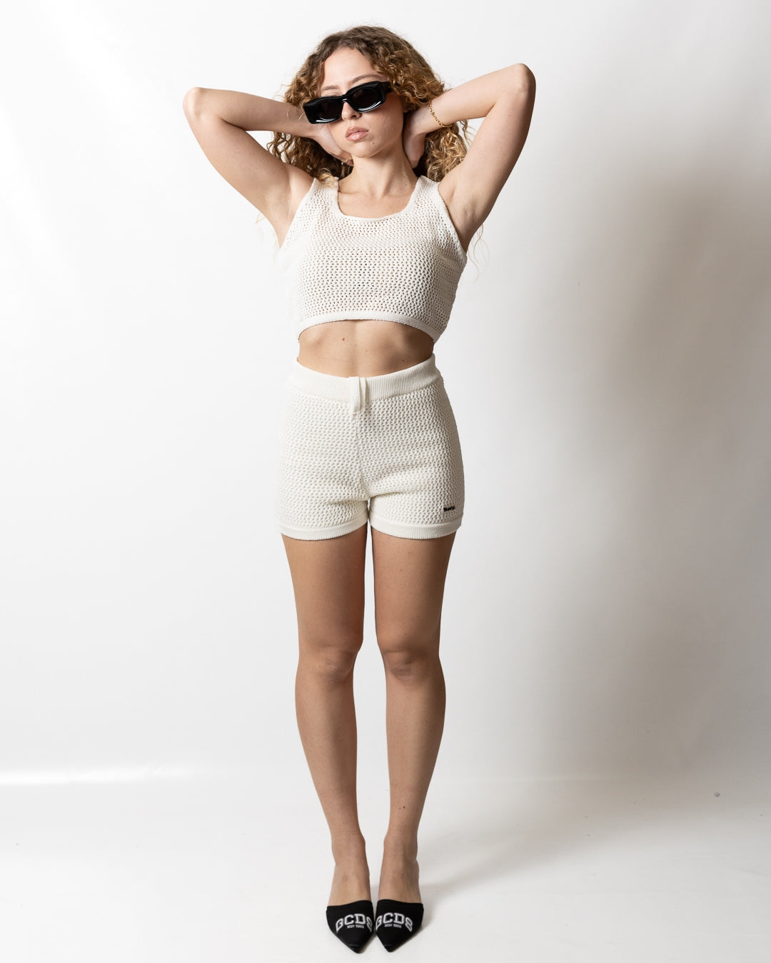 Top Disclaimer cropped in maglia traforata donna