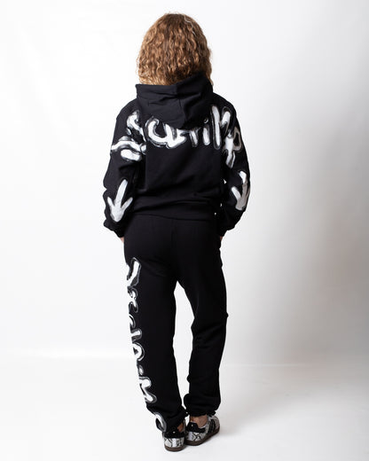 Pantalone Disclaimer in felpa con logo glitterato donna