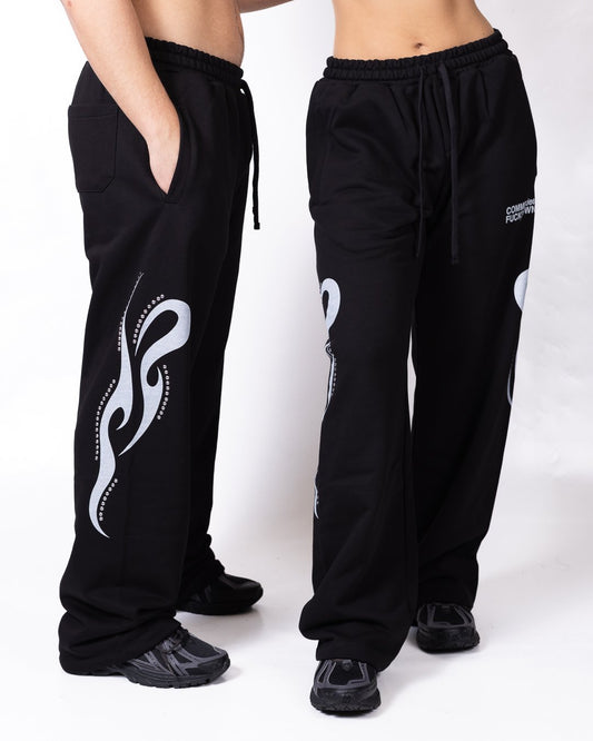 Pantalone Comme des Fuckdown con stampa e borchie