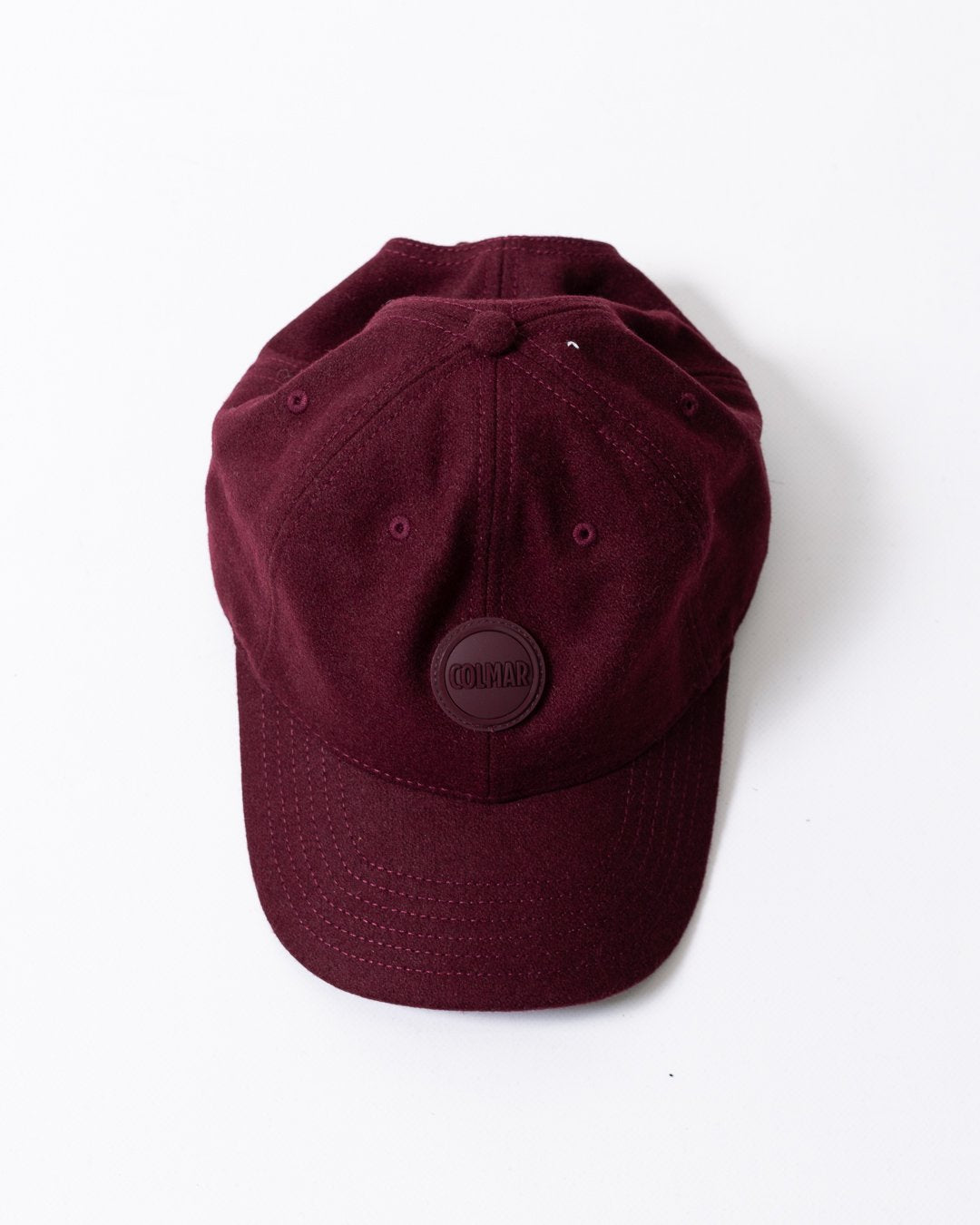 Cappello Colmar in lana con visiera e logo in rilievo