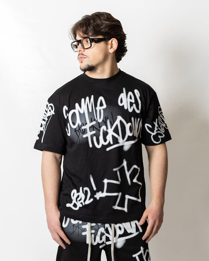 T-Shirt Comme des Fuckdown con stampa spray uomo