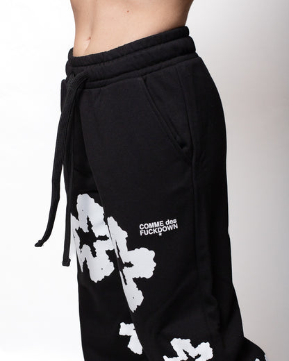 Pantalone Comme des Fuckdown in felpa con fiori all-over donna