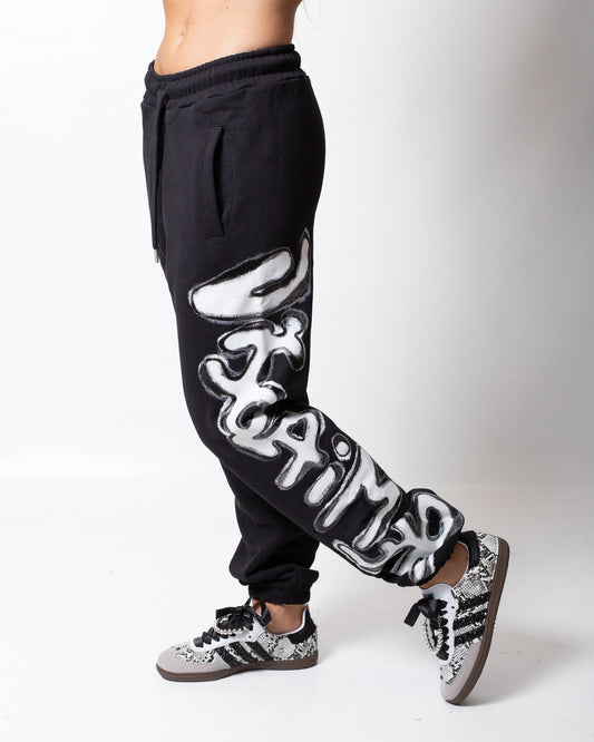 Pantalone Disclaimer in felpa con logo glitterato donna