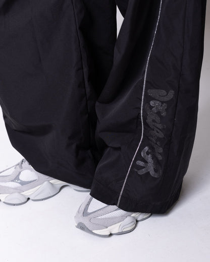 Pantalone Disclaimer con logo glitter e dettagli laminati