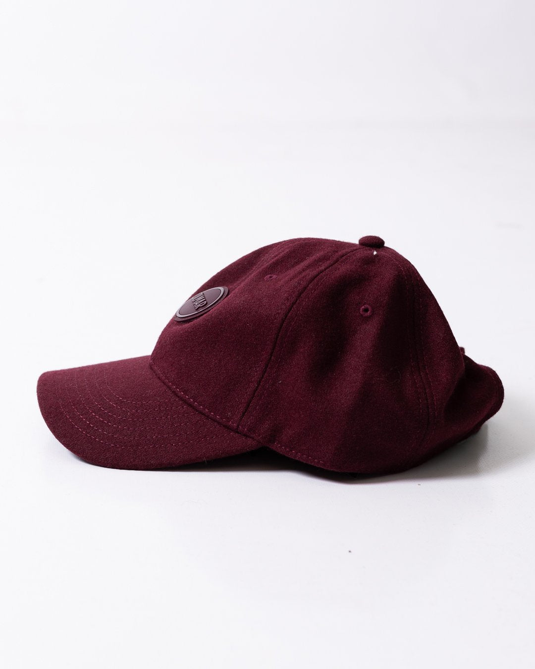 Cappello Colmar in lana con visiera e logo in rilievo