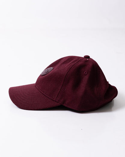 Cappello Colmar in lana con visiera e logo in rilievo
