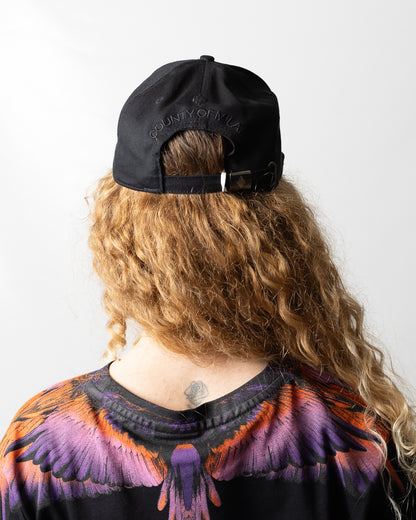 Cappello Marcelo Burlon con visiera "Icon Wings Orange"