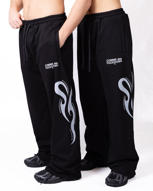 Pantalone Comme des Fuckdown con stampa e borchie