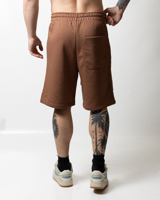 Bermuda Comme des Fuckdown in felpa con tagli e logo uomo