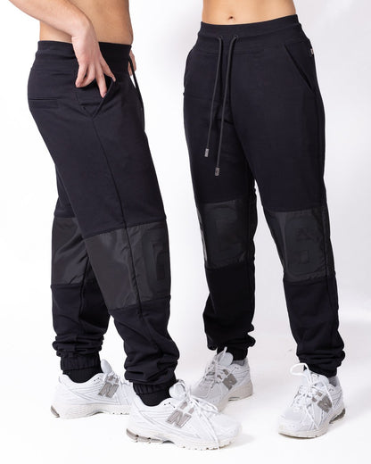 Pantalone GCDS mix di tessuti con logo gommato in rilievo